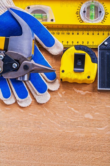 Brown wooden board with protective gloves