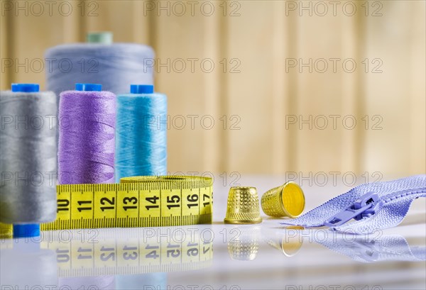 Arrangement of sewing utensils on a white table