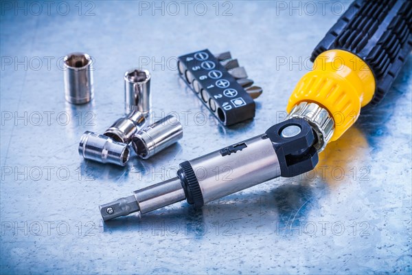 Horizontal image of reversible screw Screwdriver bits and Torx on metallic background Construction concept