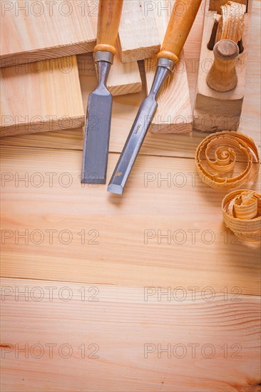 Copyspace image composition of woodworking tools carpentry chisel and plane on wooden boards building concept