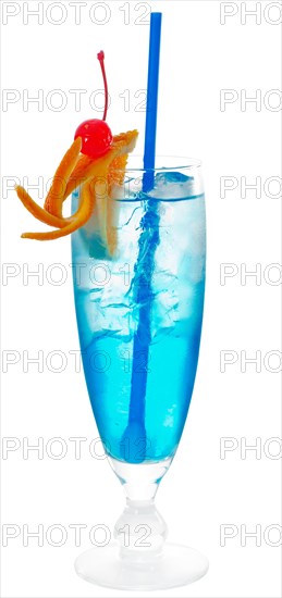 Blue long drink cocktail with orange and cherry garnish and blue straw