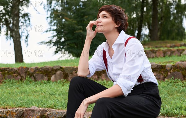 Image of a stylish beautiful woman in a white shirt