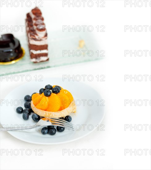 Fresh blueberry and tangerine orange cream cupcake homemade closeup macro