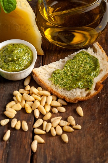 Italian basil pesto bruschetta ingredients over old wood macro