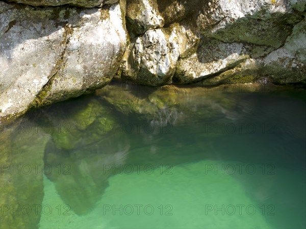 Emerald green Soca River with crystal clear water