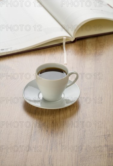Diary with a cup of coffee