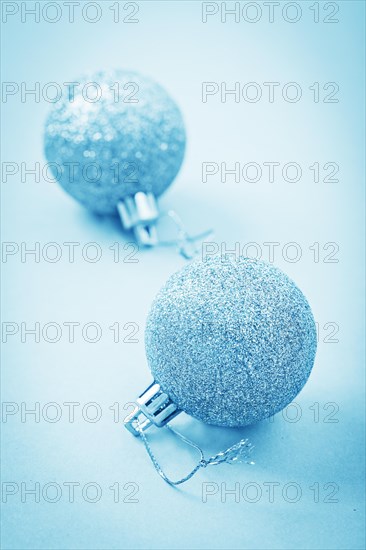 Two light blue Christmas baubles