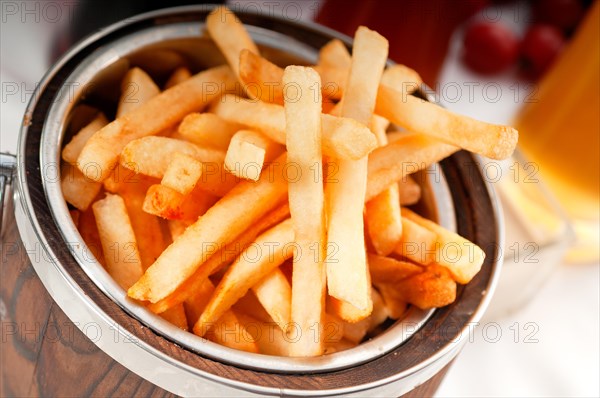 Fresh french fries on a bucket extreme close up macro