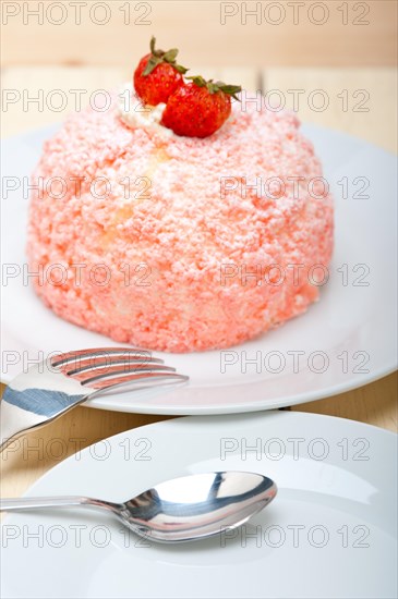 Fresh pink strawberry and whipped cream dessert macro close up