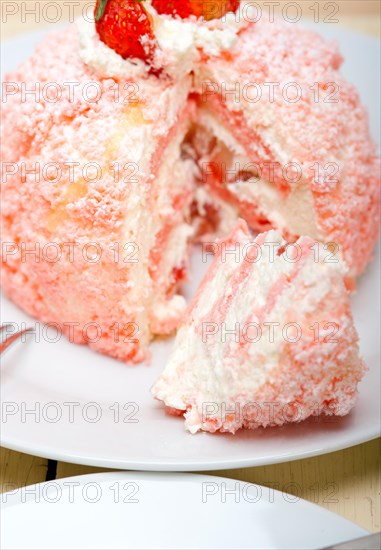 Fresh pink strawberry and whipped cream dessert macro close up