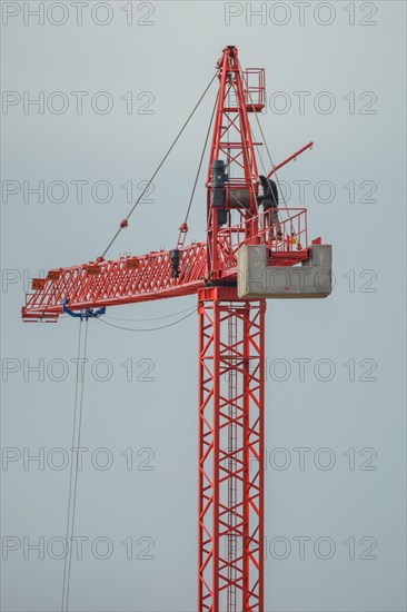 Professional crane operator inspecting the crane at high altitude