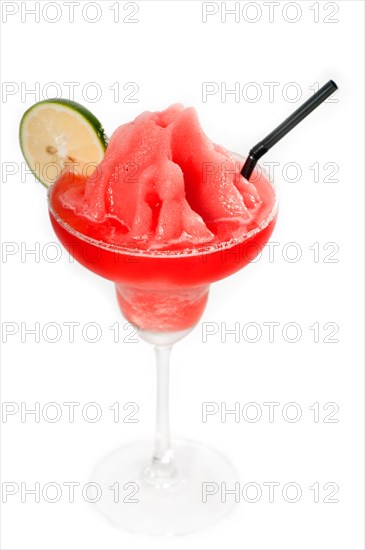 Frozen strawberry margarita daiquiri with lime and black straw isolated on white background