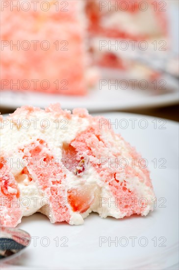 Fresh pink strawberry and whipped cream dessert macro close up