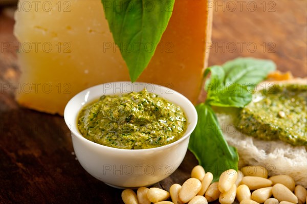 Italian basil pesto bruschetta ingredients over old wood macro