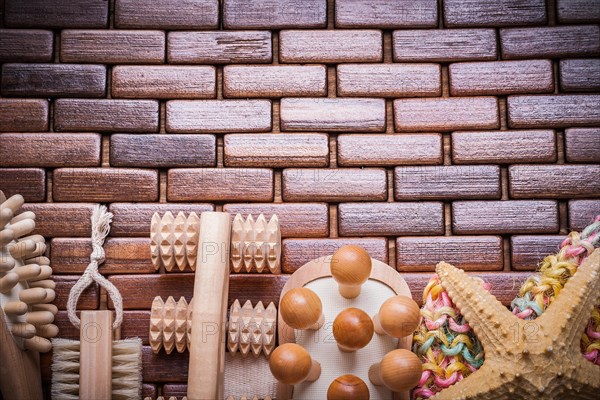 Group of bathing articles on textured wooden table mat healthcare concept