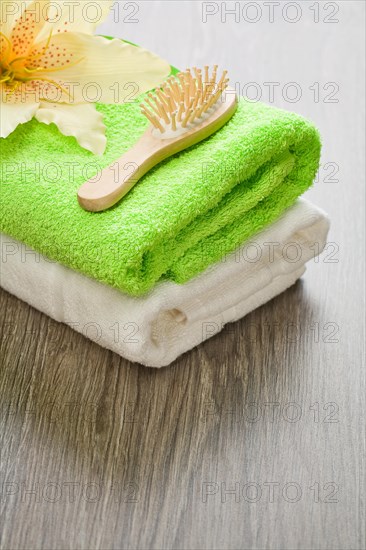 Flower on towels with hairbrush