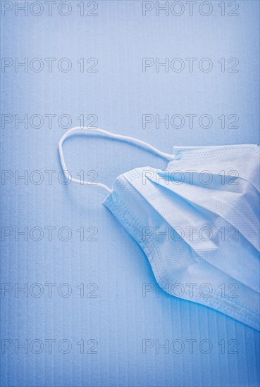 Medical mask on blue background medical concept