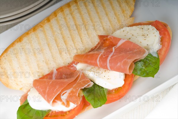 Panini sandwich with fresh caprese and parma ham