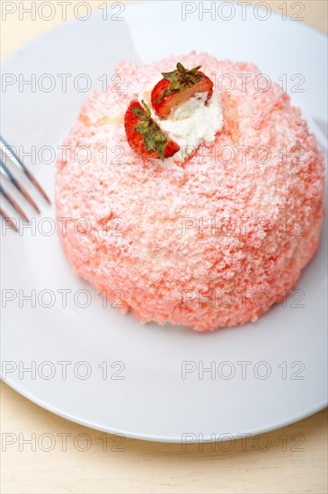 Fresh pink strawberry and whipped cream dessert macro close up