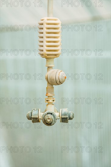 Agricultural equipment Water sprayer in the greenhouse Close-up