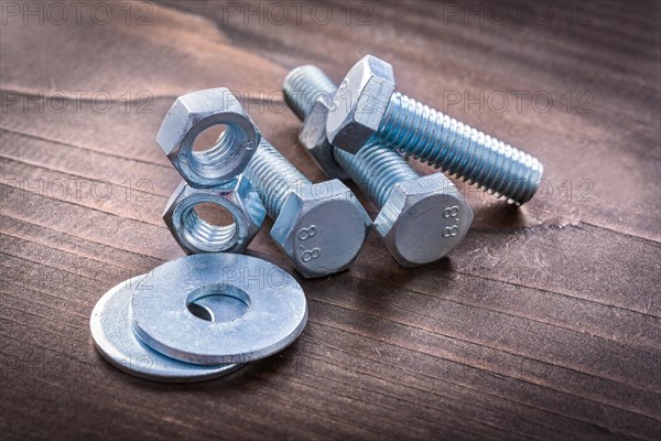 Group of stainless steel objects on vintage brown wooden board construction concept