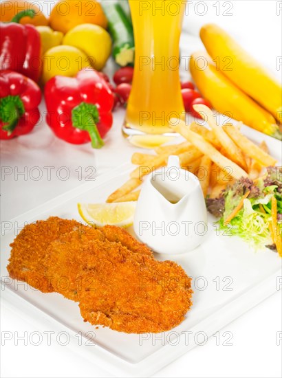 Classic breaded Milanese veal cutlets with french fries