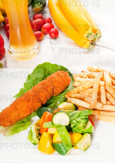 Fresh breaded chicken breast roll and vegetables