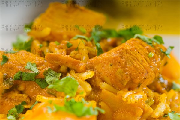 Fresh home made curry beef rice and potatoes with ingredients around composition