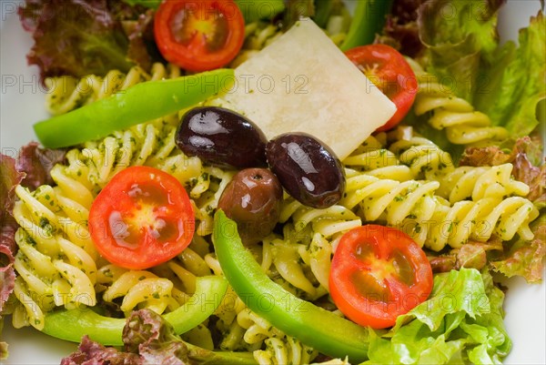 Fresh healthy homemade italian fusilli pasta salad with parmesan cheese