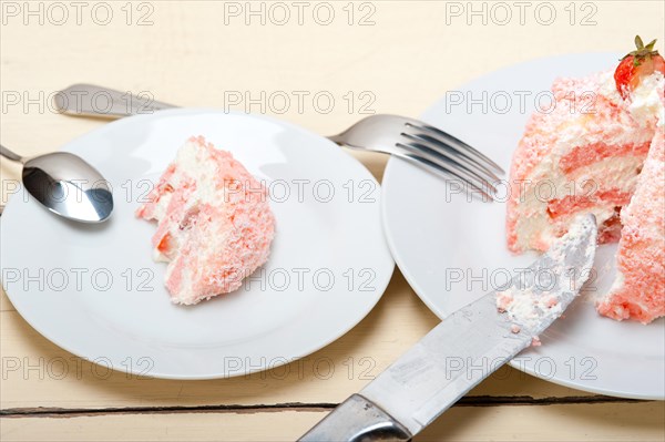 Fresh pink strawberry and whipped cream dessert macro close up