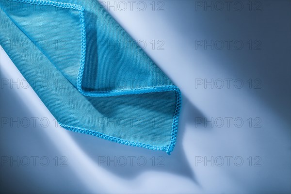 Blue cleaning cloth on white background