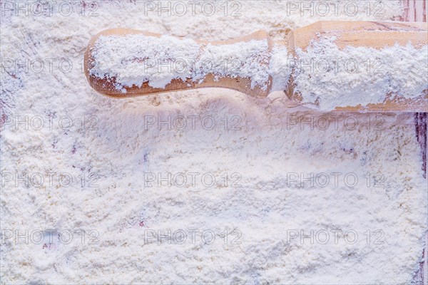 Copyspace photo handle of a wooden rolling pin with flour food and beverage concept horizontal version