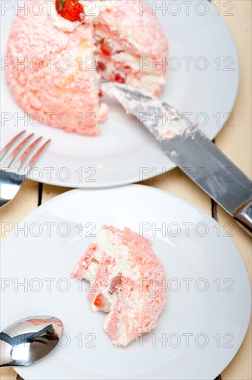 Fresh pink strawberry and whipped cream dessert macro close up