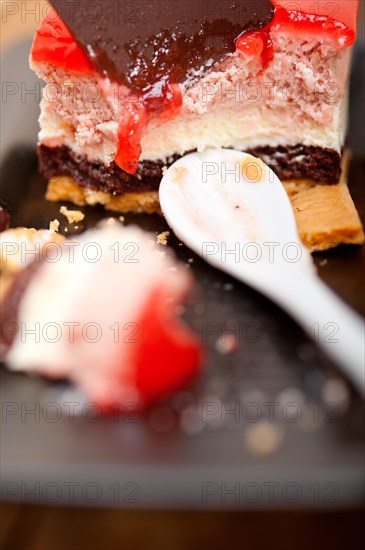 Fresh strawberry yogurt mousse with macaroon and blueberry on top