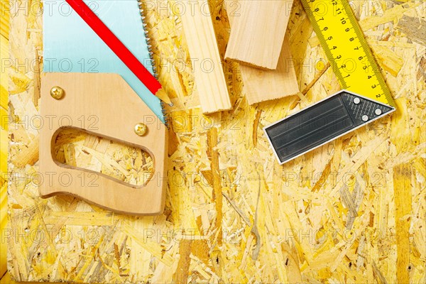 Carpentry tools on plywood panel