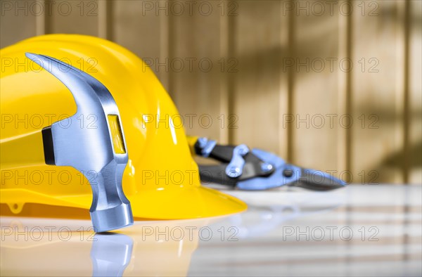 Claw hammer with safety helmet and steel cutter