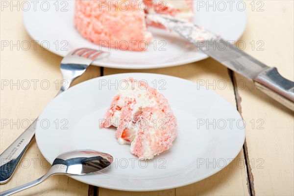 Fresh pink strawberry and whipped cream dessert macro close up