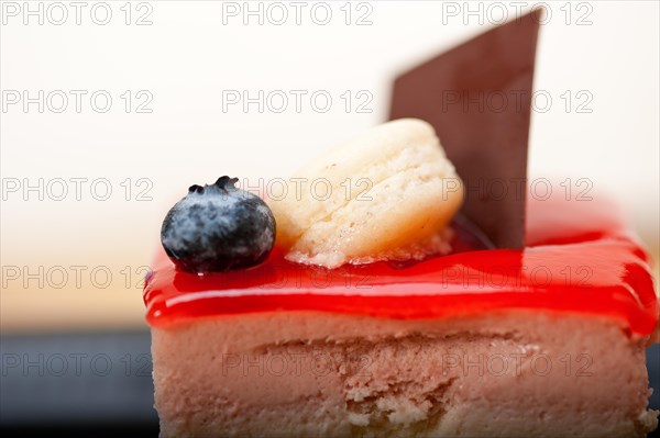 Fresh strawberry yogurt mousse with macaroon and blueberry on top