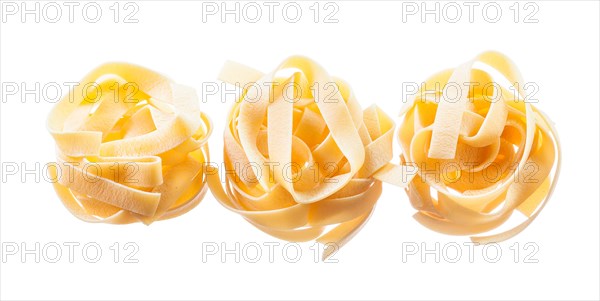 Raw twisted macaroni isolated on white