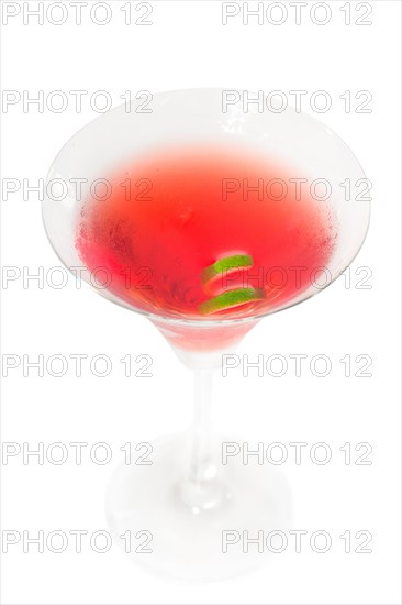 Cosmopolitan drink cocktail straight up on martini cup with lime peel isolated on white background