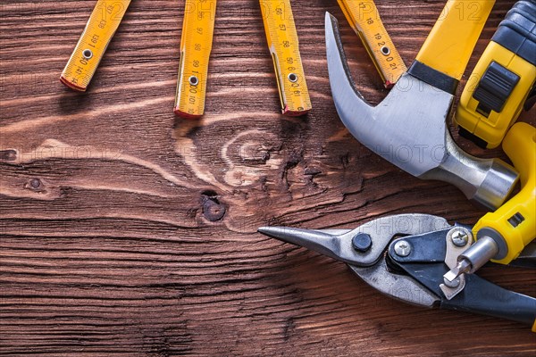 Collection of various tools on wooden panel Construction concept