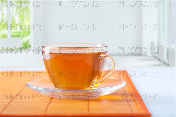 Cup of tea on the table in an empty room
