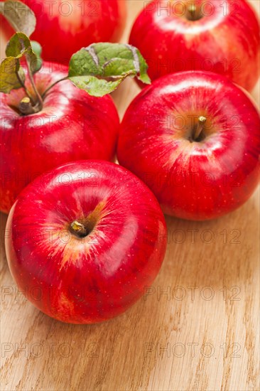 Fresh apples on a wooden board