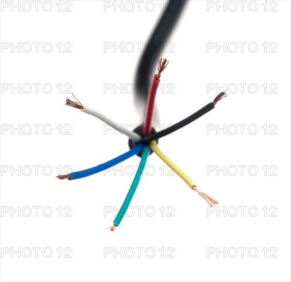 Color coded electric wire over white background