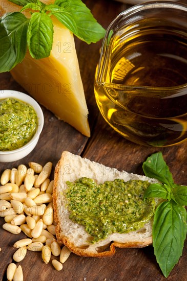 Italian basil pesto bruschetta ingredients over old wood macro