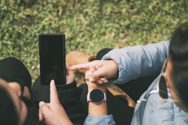 Cropped hands of a woman with a smart watch