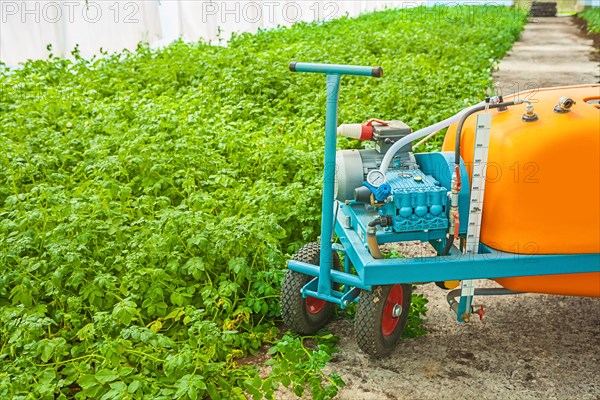 Large pesticide sprayer in the greenhouse