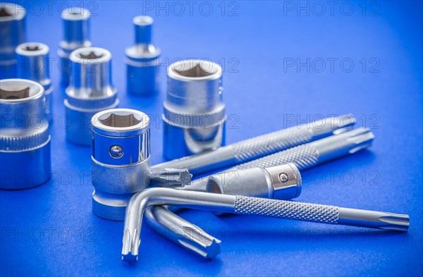 Hexagon spanner and Torx on blue background