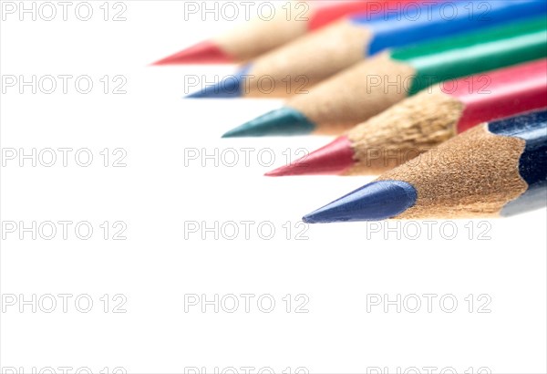 Coulor wooden sharpened pencils over white background