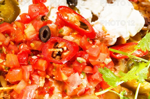 Fresh nachos and vegetable salad with meat